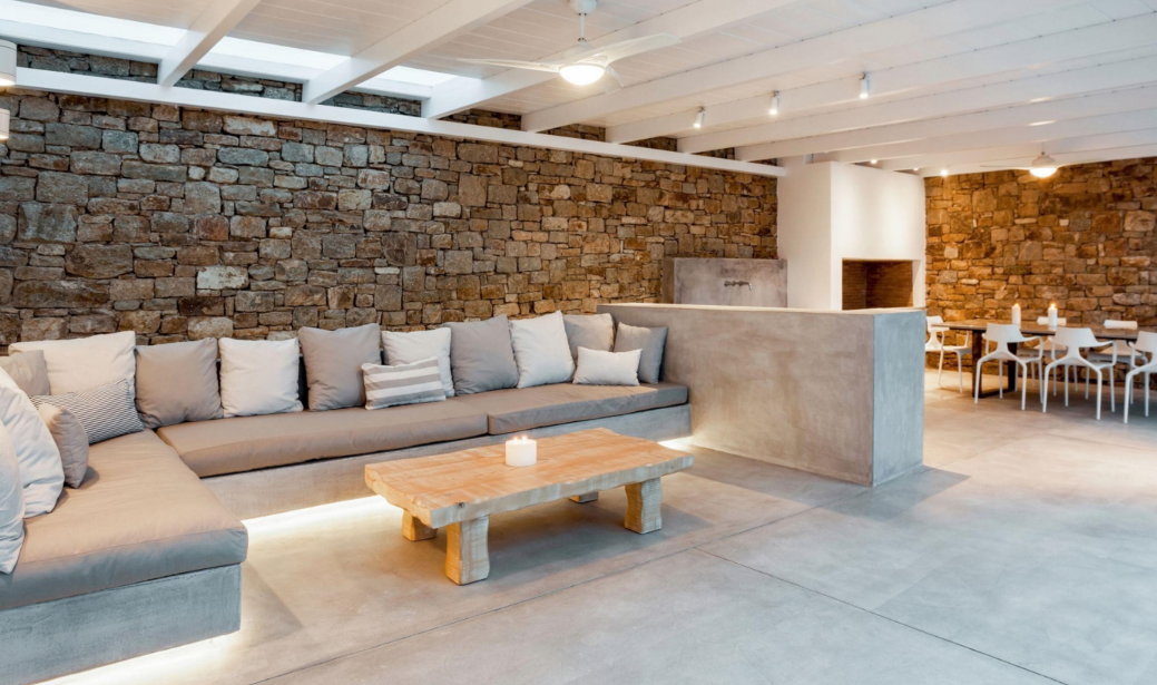 modern-living-room-with-stone-walls-and-concrete-furniture