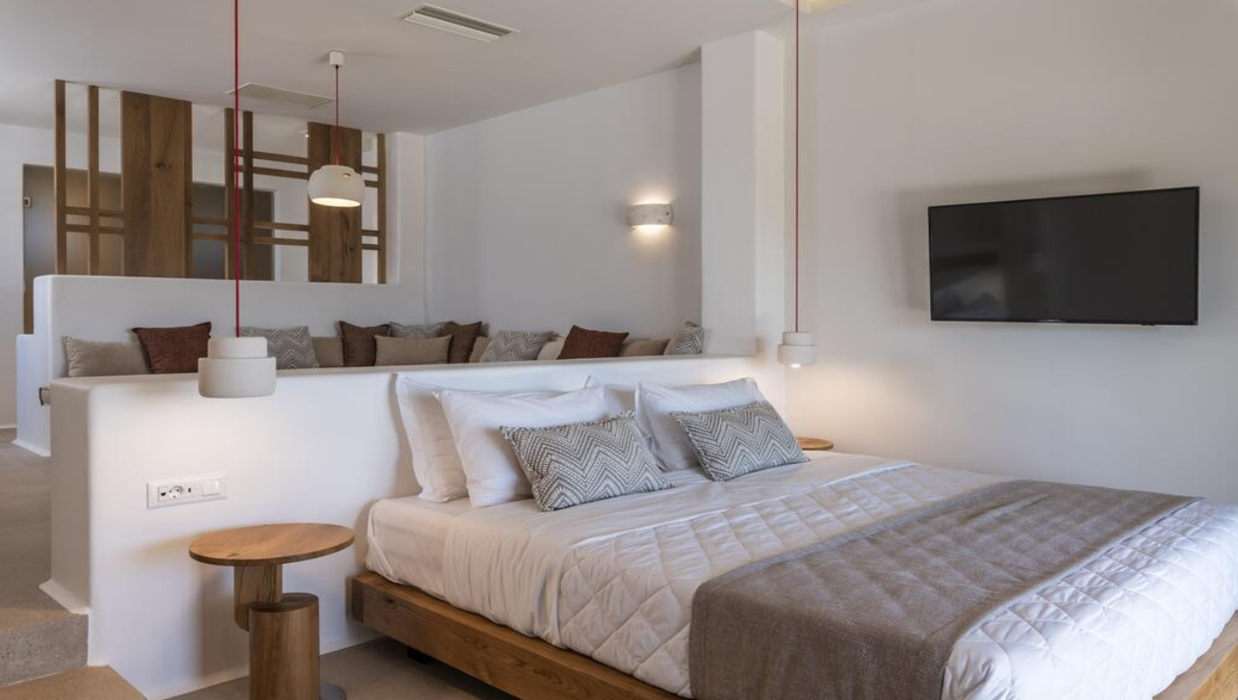 modern-bedroom-with-tv-and-seating-area-ibiza