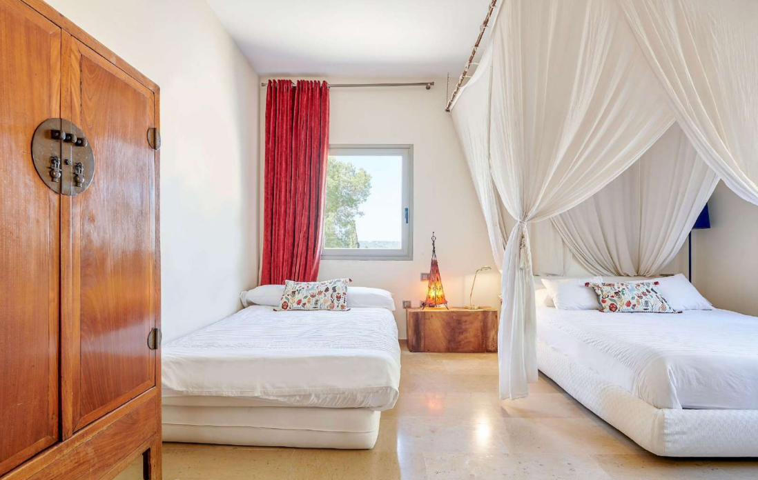 luxury-bedroom-ibiza-villa-canopy-bed-wooden-cabinet
