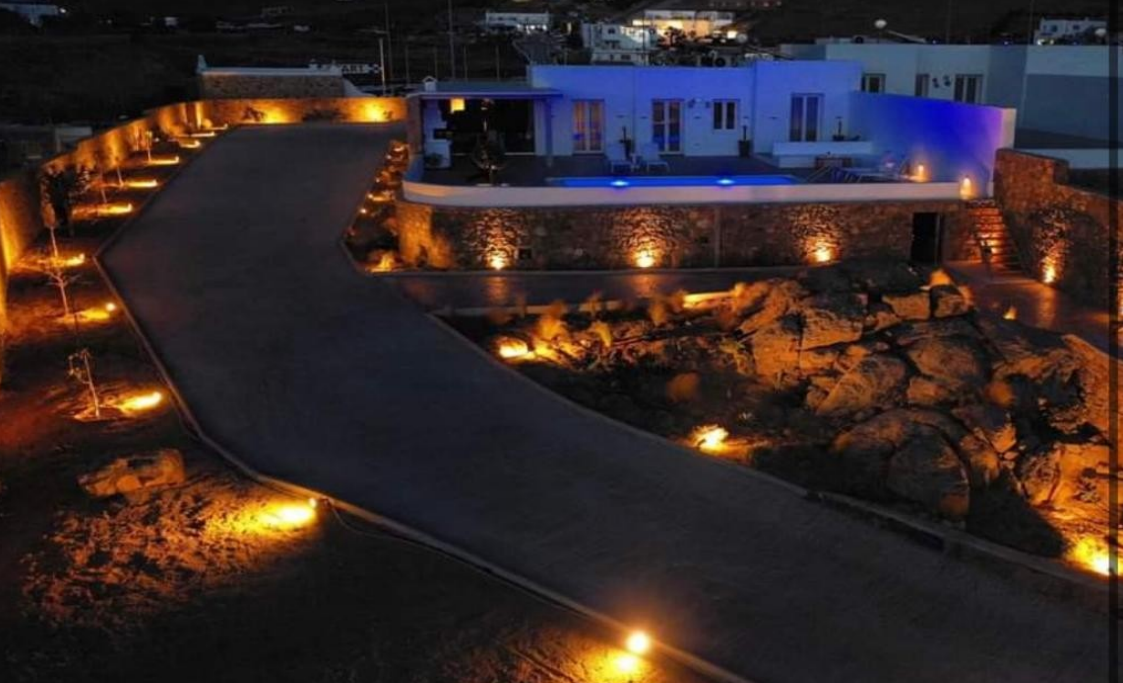 luxury-villa-night-view-with-lights-and-driveway-ibiza