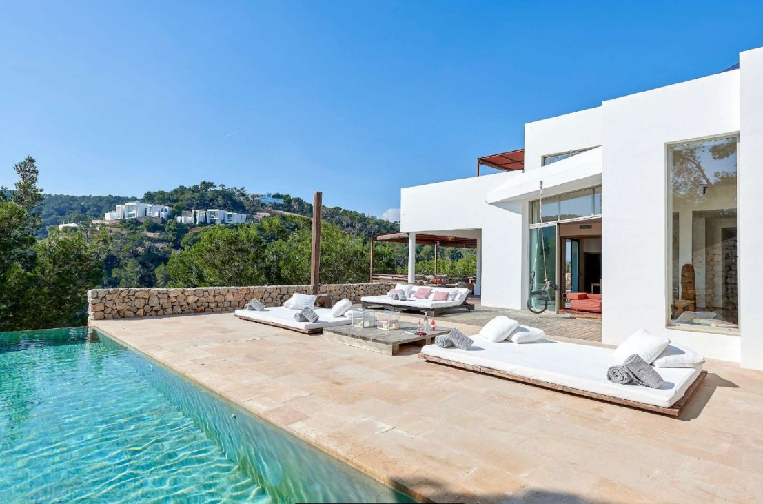 luxury-villa-ibiza-infinity-pool-sunbeds-hillside-view