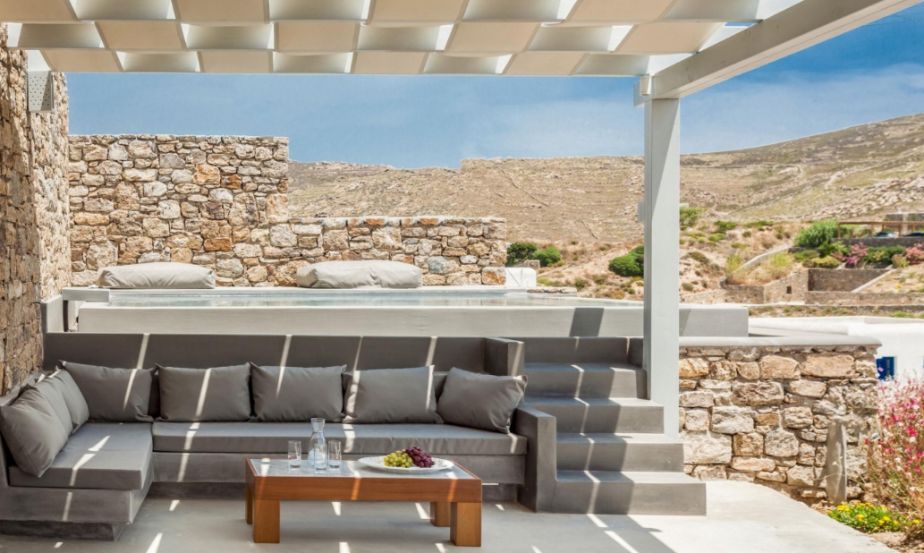 stone-wall-patio-seating-relaxing-outdoor-lounge-area