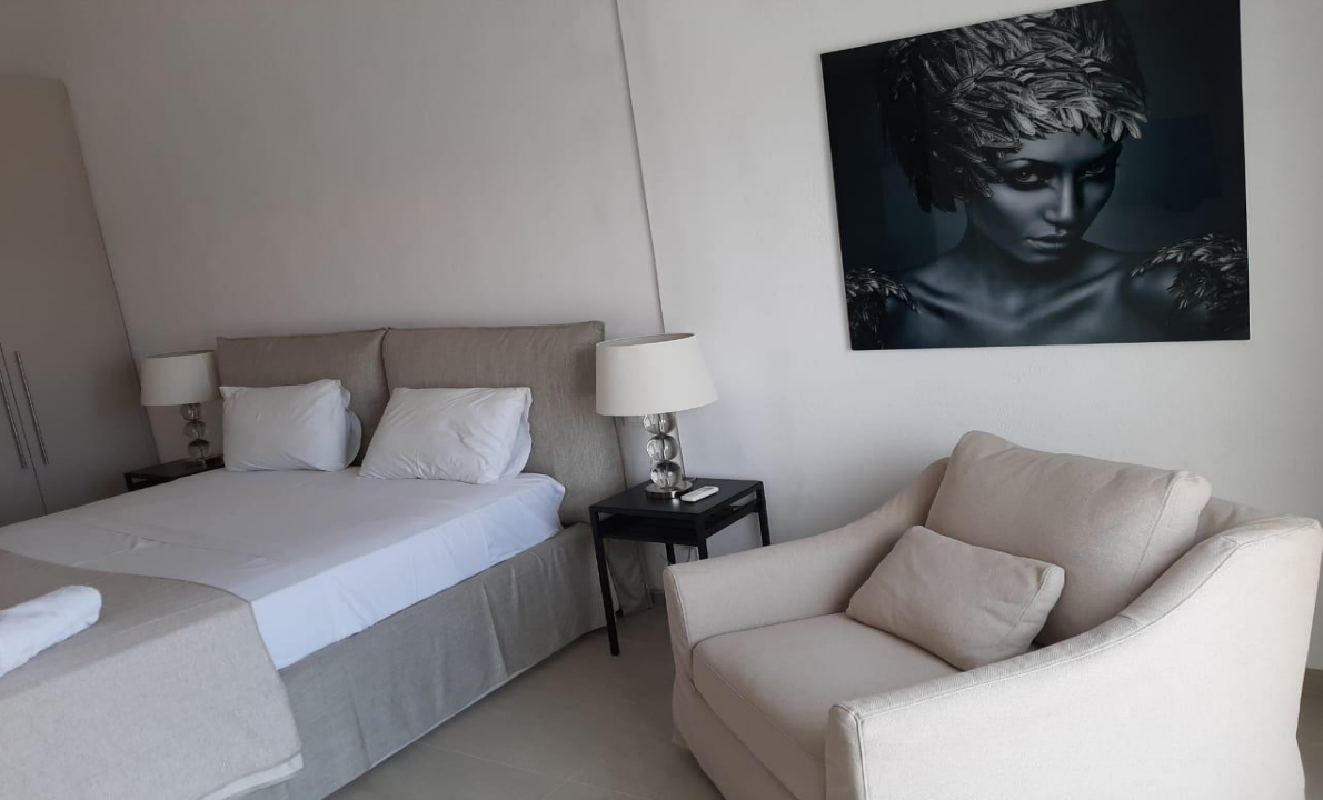 luxury-villa-bedroom-with-modern-furniture-and-artwork-ibiza